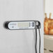 A black AvaTemp digital folding probe thermometer with a screen.