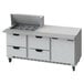 A Beverage-Air stainless steel refrigerated sandwich prep table with 4 drawers on a counter in a professional kitchen.