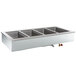 A Delfield drop-in hot food well with three compartments on a counter.