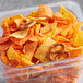 A plastic container of Good's Party Mix with chips and pretzels.