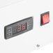 The white panel of an Avantco 60" Countertop Bakery Display Case with a digital temperature control.