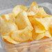 A plastic container of Goods BBQ Homestyle Potato Chips.