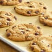 A close-up of a chocolate chip cookie with Enjoy Life Dark Vegan Chocolate Chips.