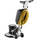 A Lavex floor machine with a yellow cord and solution tank attached.