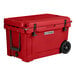 A red CaterGator outdoor cooler with black wheels.