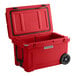 A red CaterGator outdoor cooler with wheels.