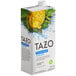 A white carton of Tazo Unsweetened Iced Zen Green Tea Concentrate with a picture of a bowl of tea.