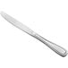 An Acopa Scottdale stainless steel dinner knife with a white background.