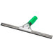 An Unger ErgoTec window squeegee with a green handle.