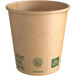 A New Roots brown paper hot cup with green earth friendly text.