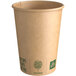 A New Roots brown paper hot cup with green text.