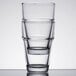 An Anchor Hocking stack of 3 beverage glasses on a white surface.