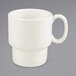 A Tuxton eggshell white mug with a handle.