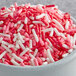 A bowl of Regal Valentine's Day Sprinkle Mix with pink and white sprinkles.