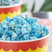 Blue and white popcorn in a bowl with blue raspberry glaze.