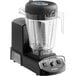 A black Vitamix 5205 blender with a clear container on a white background.