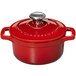 A Chasseur ruby red enameled cast iron pot with a lid.