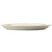 A Libbey Porcelana white oval platter with a narrow rim.