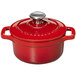 A Chasseur ruby red enameled cast iron pot with a lid.