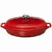 A Chasseur ruby red enameled cast iron oval brazier/casserole with a lid.