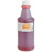 A 32 oz. bottle of LorAnn Oils Orange Liquid Gel Food Coloring with orange liquid inside.