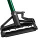 A close up of a green and black Lavex metal mop handle with a quick release feature.