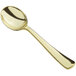 A close up of a Visions gold plastic soup spoon with a handle.
