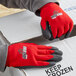 A person wearing Cordova red nylon thermal gloves with black foam PVC palm coating.