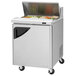 A Turbo Air stainless steel refrigerated sandwich prep table with a glass door.