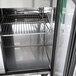 A close-up of the inside of a Turbo Air 1 door sandwich prep refrigerator with a shelf.