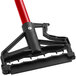 A red and black Lavex metal mop handle with a red release button.