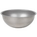 A close-up of a silver Vollrath stainless steel mixing bowl with a rim.