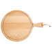 A Boska round beech wood serving board with a handle.
