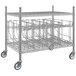 A Regency chrome mobile wire rack with 4 can racks.