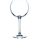 A close-up of a clear Chef & Sommelier balloon wine glass with a stem.