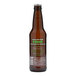 A close up of a brown Casamara Club Como Breezy Mandarina Leisure Soda bottle with green text.