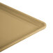 A close-up of a large rectangular Cambro earthen gold dietary tray.