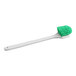 A close up of a green Lavex floating pot scrub brush with a white handle.