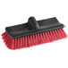 A red and black Lavex floor scrub brush with a red handle.