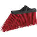 A red Lavex broom head with black bristles.