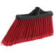A red Lavex angled broom head with black flagged bristles.