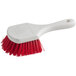 A red and white Lavex floating utility/pot scrub brush with a red handle.