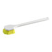 A white Lavex pot scrub brush with yellow bristles and handle.