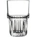 A close up of a Libbey Everest highball glass with a faceted rim.