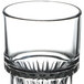 A clear Libbey highball glass with a patterned rim.