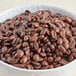 A bowl of Ellis Mezzaroma whole coffee beans.