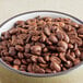 A bowl of Ellis whole bean coffee on a table.