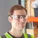 A man wearing Honeywell Uvex Safety Glasses.