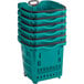 A stack of green plastic shopping baskets.