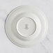 A white RAK Porcelain deep plate with an embossed crown logo.